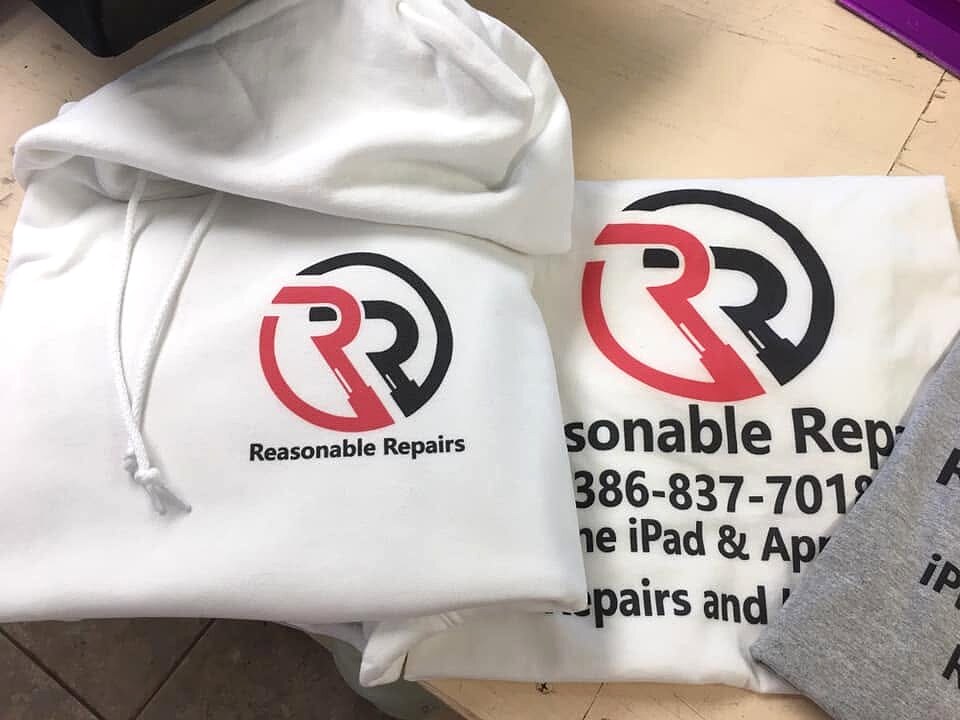 White Reasonable Repairs hoodie and printed shirts
