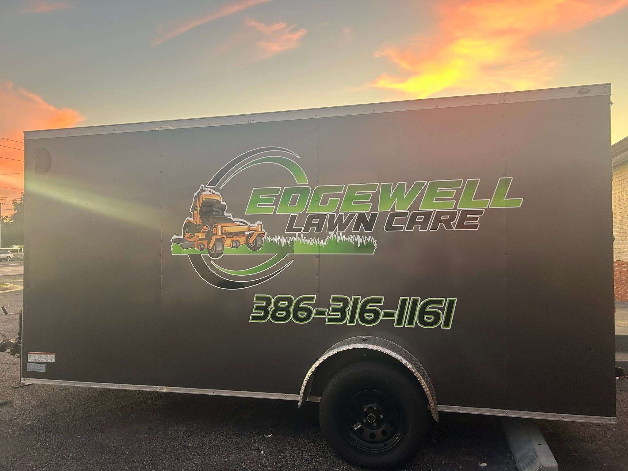 Complete Edgewell Lawn Care enclosed trailer with graphics