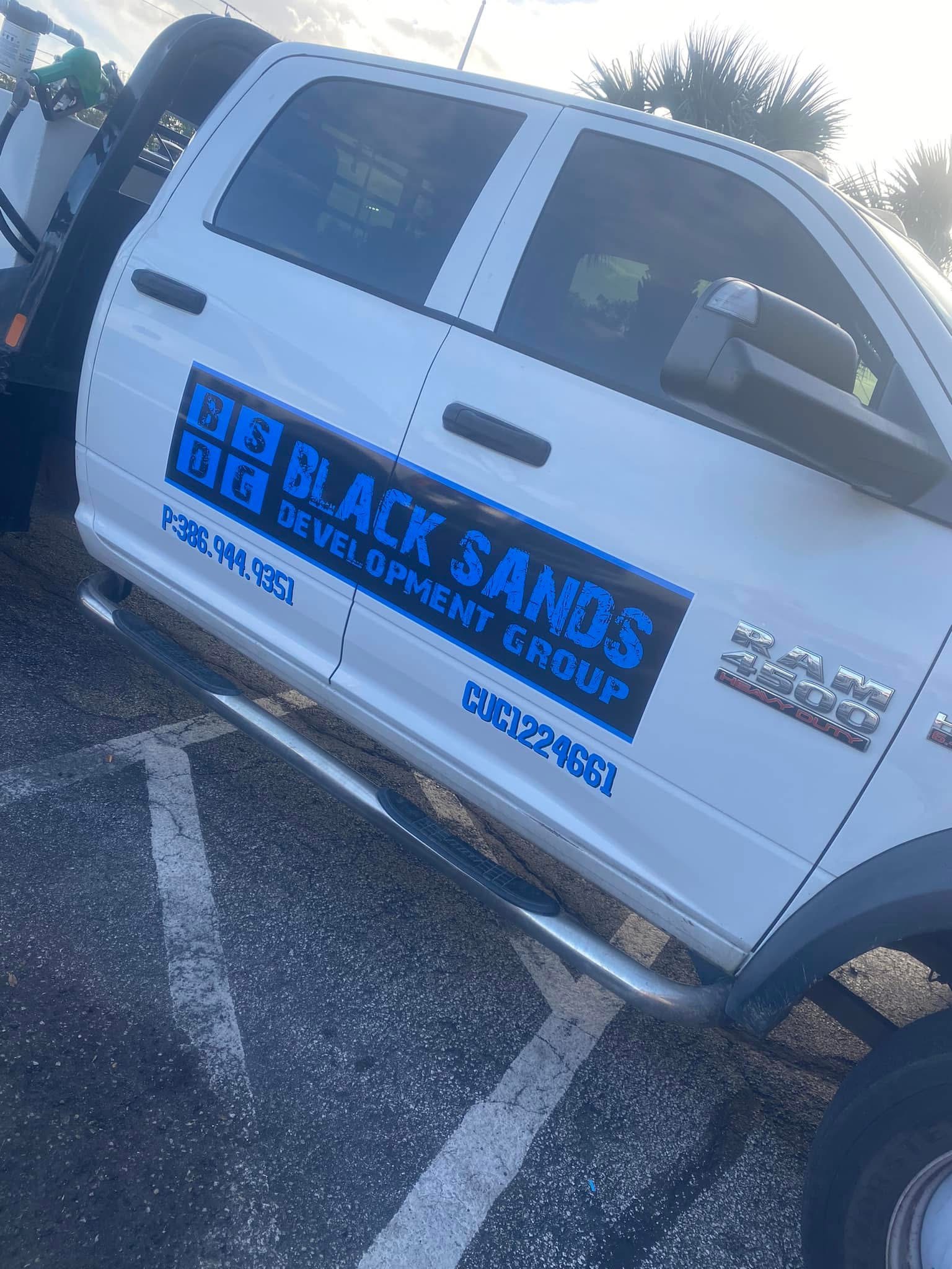 Complete Big Black Sands Development Group truck with lettering