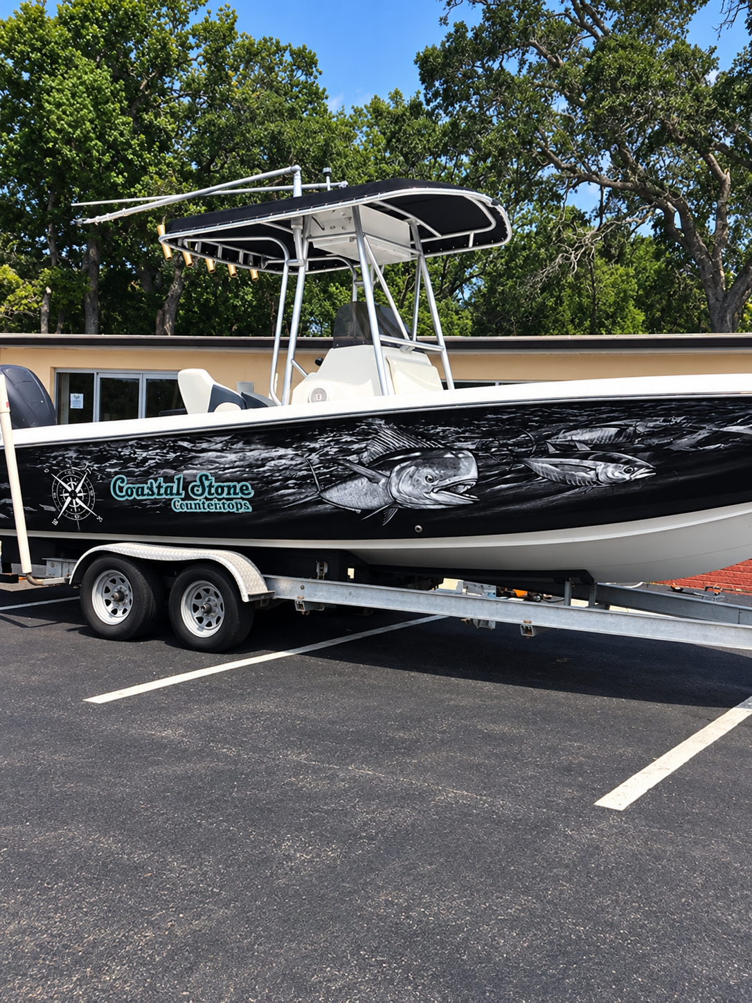 Complete fishing boat and trailer with custom marine graphics