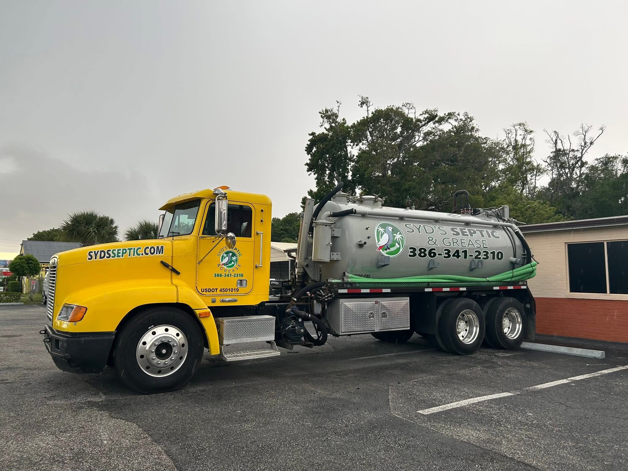 Complete septic service truck with fleet graphics